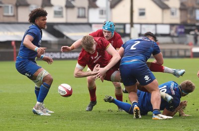 150326 - Wales v Italy, U20 Six Nations 2026 - Osian Williams of Wales loses the ball as he is tackled