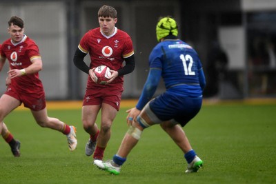 150326 - Wales U20 v Italy U20 - U20 Six Nations Championship - Steffan Emanuel of Wales is challenged by Riccardo Casarin of italy