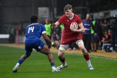 150326 - Wales U20 v Italy U20 - U20 Six Nations Championship - Lewis Edwards of Wales is challenged by Malik Faissal of italy