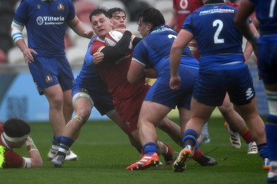150326 - Wales U20 v Italy U20 - U20 Six Nations Championship - Sion Davies of Wales is challenged by Luca Trevisan of italy