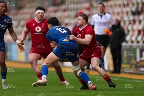 150326 - Wales v Italy, U20 Six Nations 2026 - Tom Bowen of Wales holds Pietro Celi of Italy