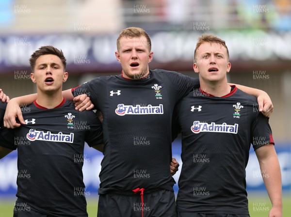 070618 -  Wales U20 v Japan U20, World Rugby U20 Championship, Pool A - Left to right, Dewi Cross of Wales, Jack Pope of Wales and Tommy Reffell of Wales during the anthems ahead of the match against Japan