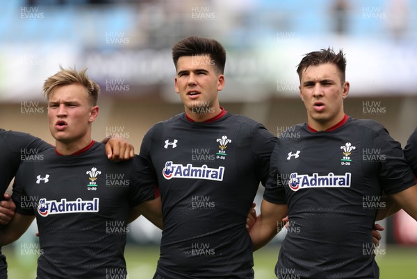 070618 -  Wales U20 v Japan U20, World Rugby U20 Championship, Pool A - Left to right, Harri Morgan of Wales, Tiaan Thomas-Wheeler of Wales and Taine Basham of Wales during the anthems ahead of the match against Japan
