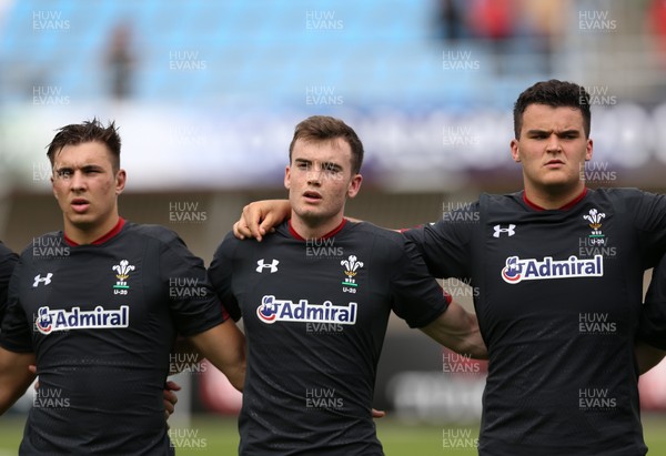 070618 -  Wales U20 v Japan U20, World Rugby U20 Championship, Pool A - Left to right, Taine Basham of Wales, Cai Evans of Wales and Chris Coleman of Wales during the anthems ahead of the match against Japan