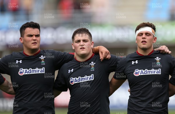 070618 -  Wales U20 v Japan U20, World Rugby U20 Championship, Pool A - Left to right, Chris Coleman of Wales, Rhys Davies of Wales and Lennon Greggains of Wales during the anthems ahead of the match against Japan