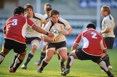 10.06.08 - Wales Under 20s v Japan Under 20s - IRB Junior World Championship - Wales' Ryan Prosser is tackled by Motoki Yamazaki(R) and Keiichi Tanaka 