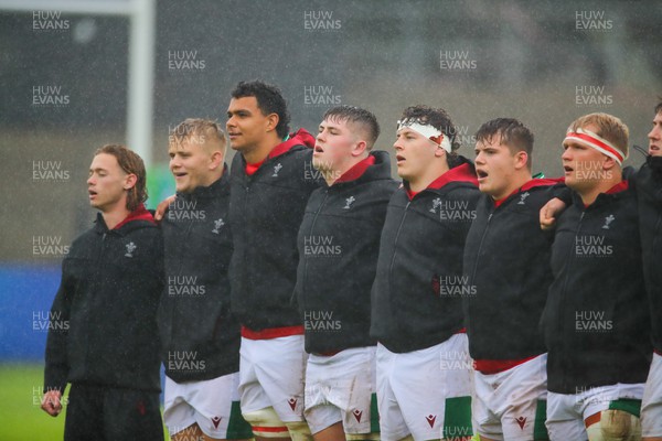 290623 - Wales v Japan - World Rugby U20 Championship - Harri Wiliams of Wales (left) and his team mates sings the Welsh national anthem