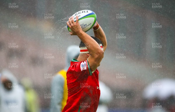 290623 - Wales v Japan - World Rugby U20 Championship - Lewis Lloyd of Wales throws in a very wet ball into the line out after heavy showers
