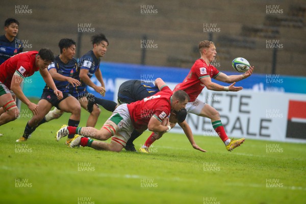 290623 - Wales v Japan - World Rugby U20 Championship - Harri Houston of Wales grabs the ball on his way to the try line