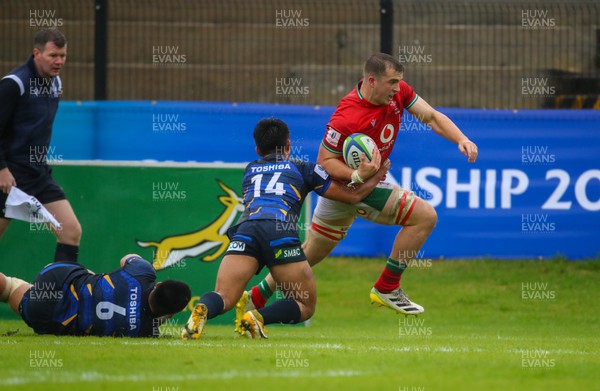 290623 - Wales v Japan - World Rugby U20 Championship - Louie Hennessey of Wales tries to evade a tackle