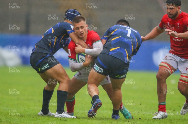 290623 - Wales v Japan - World Rugby U20 Championship - Cameron Winnett of Wales is tackled by 2 Japanese players