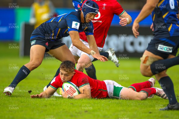 290623 - Wales v Japan - World Rugby U20 Championship - Dan Edwards of Wales is tackled by Kanjiro Maramoto of Japan