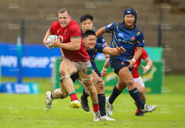 290623 - Wales v Japan - World Rugby U20 Championship - Morgan Morse of Wales breaks free from a Japanese tackle
