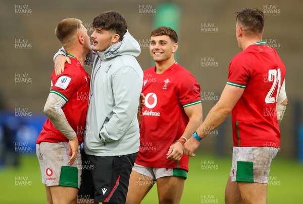 290623 - Wales v Japan - World Rugby U20 Championship - an ecstatic Welsh team, congratulate each other