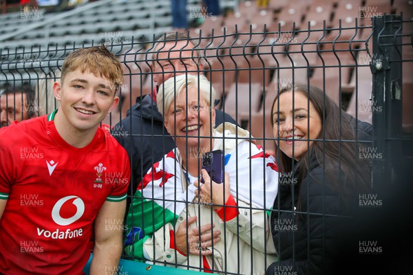 290623 - Wales v Japan - World Rugby U20 Championship - Dan Edwards of Wales with his family after the match