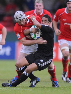 18.06.08 - Wales Under 20 v New Zealand Under 20 - Junior World Championship 2008 - New Zealand's Aaron Smith is tackled by Jonathan Davies. 