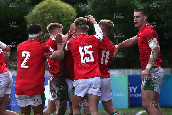240623 - Wales v New Zealand - World Rugby U20 Championship - Dan Edwards of Wales is congratulated for scoring a try