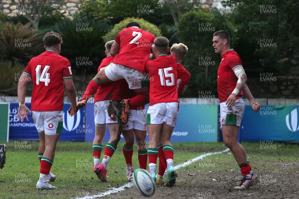 240623 - Wales v New Zealand - World Rugby U20 Championship - Dan Edwards of Wales is congratulated for scoring a try