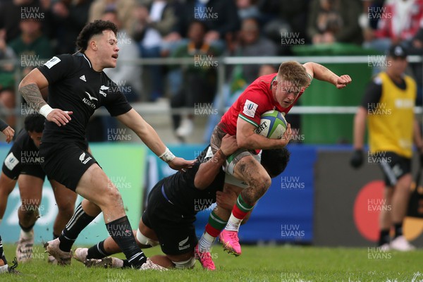 240623 - Wales v New Zealand - World Rugby U20 Championship - Archie Hughes of Wales is tackled by Sam Hainsworth-Fa’aofo of New Zealand
