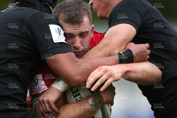 240623 - Wales v New Zealand - World Rugby U20 Championship - Morgan Morse of Wales attempts to break through the tackle