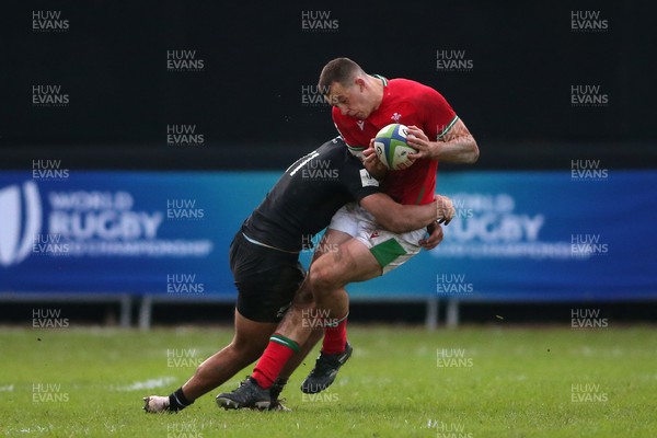 240623 - Wales v New Zealand - World Rugby U20 Championship - Macca Springer of New Zealand tackles Louie Hennessey of Wales