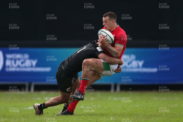 240623 - Wales v New Zealand - World Rugby U20 Championship - Macca Springer of New Zealand tackles Louie Hennessey of Wales