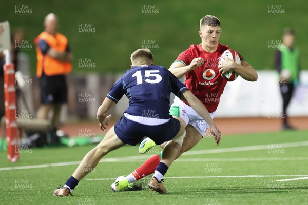 020224 - Wales v Scotland, U20 6 Nations 2024 - Harry Rees-Weldon of Wales takes on Fergus Watson of Scotland