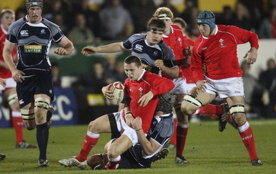 08.02.08 ... Wales U20 v Scotland U20, Newport -  Wales' Luke Evans is hauled down by Scotlands' Neale Patrick 