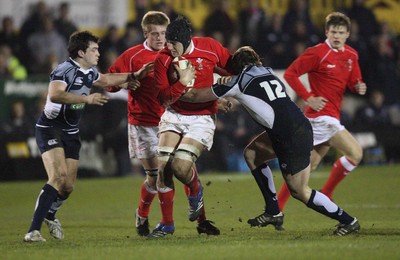 08.02.08 ... Wales U20 v Scotland U20, Newport -  Wales' Josh Turnbull is tackled by Scotlands' Stephen McColl and James Murray 