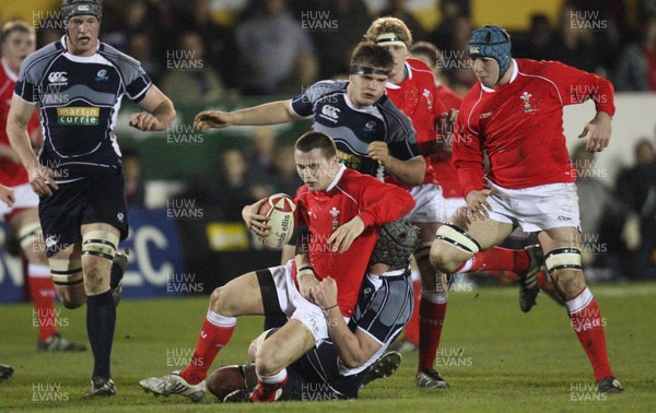 08.02.08 ... Wales U20 v Scotland U20, Newport -  Wales' Luke Evans is hauled down by Scotlands' Neale Patrick 