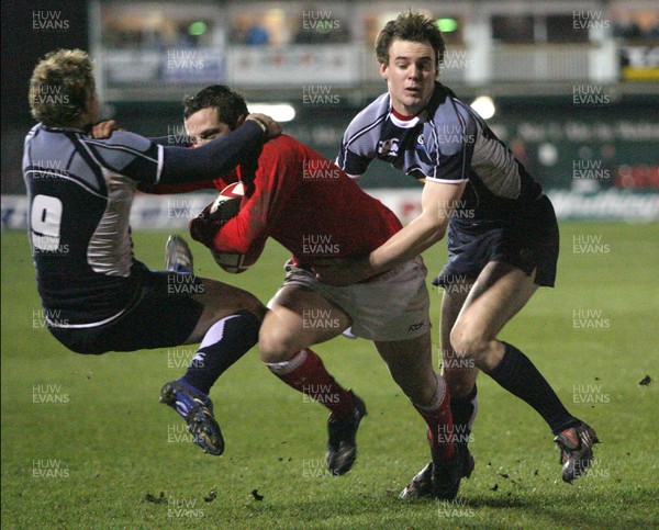 08.02.08 ... Wales U20 v Scotland U20, Newport -  Wales' Daniel Evans  drives into Scotlands' Ross Samson as Scotlands' Murray Allen assists in the tackle 