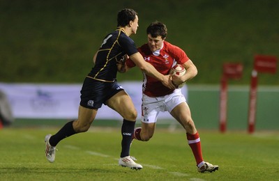 100212 - Wales Under 20 v Scotland Under 20 - Under 20 Six Nations -Luke Morgan of Wales is tackled by Jamie Farndale of Scotland