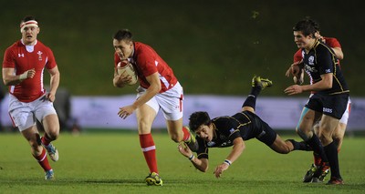 100212 - Wales Under 20 v Scotland Under 20 - Under 20 Six Nations -Cory Allen of Wales beats tackle by Tommy Allan of Scotland