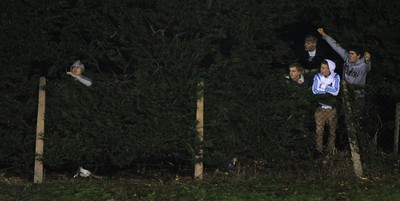 100212 - Wales Under 20 v Scotland Under 20 - Under 20 Six Nations -Fans catch a view through the hedges