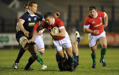 12.02.10 - Wales Under 20 v Scotland Under 20 - Under 20 Six Nations - Scott Williams of Wales is tackled by Dougie Fife of Scotland. 
