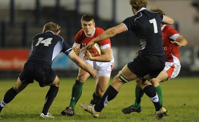 12.02.10 - Wales Under 20 v Scotland Under 20 - Under 20 Six Nations - Scott Williams of Wales takes on Oliver Grove(L) and David Denton of Scotland. 