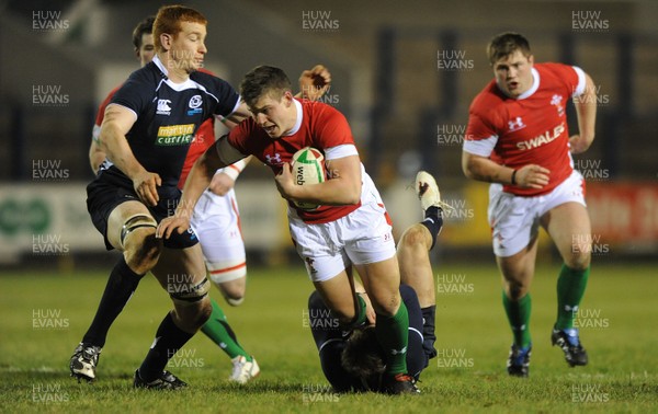 12.02.10 - Wales Under 20 v Scotland Under 20 - Under 20 Six Nations - Scott Williams of Wales is tackled by Dougie Fife of Scotland. 