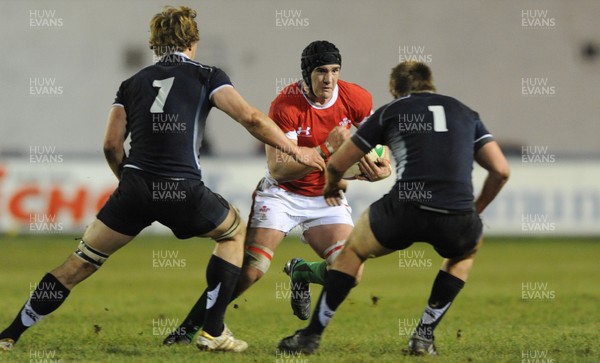 12.02.10 - Wales Under 20 v Scotland Under 20 - Under 20 Six Nations - James Thomas of Wales takes on David Denton(L) and George Hunter of Scotland. 