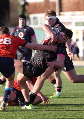 121225 - Wales U20 v Scotland U20, International Friendly - Tom Howe of Wales is tackled short of the line