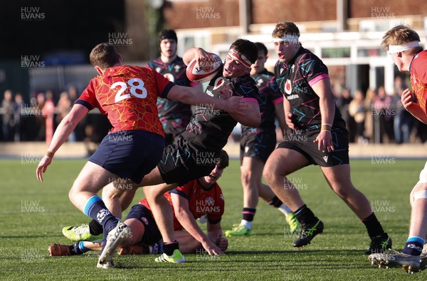 121225 - Wales U20 v Scotland U20, International Friendly - Tom Howe of Wales is tackled short of the line
