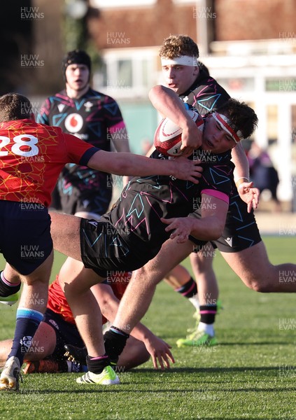 121225 - Wales U20 v Scotland U20, International Friendly - Tom Howe of Wales is tackled short of the line