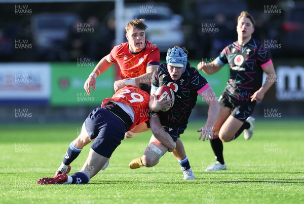 121225 - Wales U20 v Scotland U20, International Friendly - Osian Williams of Wales is tackled