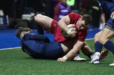 200226 - Wales U20 v Scotland U20, 2026 U20 Six Nations - Caio James of Wales is tackled by Rory McHaffie of Scotland