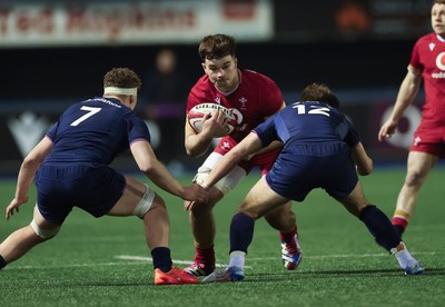 200226 - Wales U20 v Scotland U20, 2026 U20 Six Nations - Deian Gwynne of Wales takes on Ross Wolfenden of Scotland and Harvey Preston of Scotland