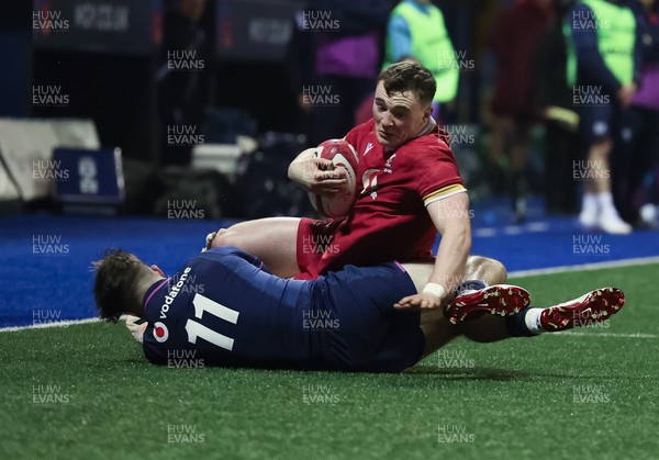 200226 - Wales U20 v Scotland U20, 2026 U20 Six Nations - Caio James of Wales is tackled by Rory McHaffie of Scotland