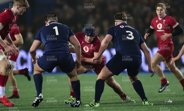 200226 - Wales U20 v Scotland U20, 2026 U20 Six Nations - Tom Howe of Wales takes on Jamie Stewart of Scotland and Ollie Blyth-Lafferty of Scotland