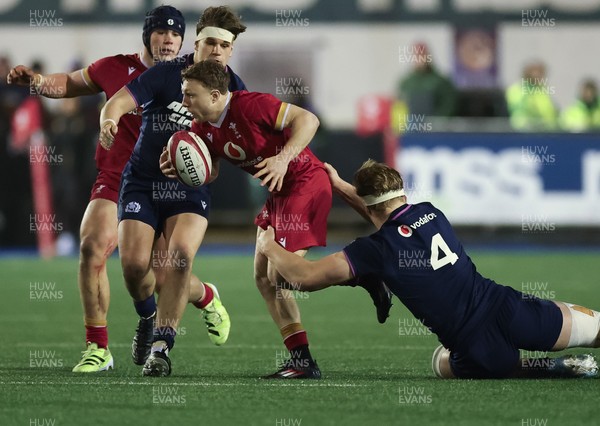 200226 - Wales U20 v Scotland U20, 2026 U20 Six Nations - Tom Bowen of Wales takes on Christian Lindsay of Scotland’