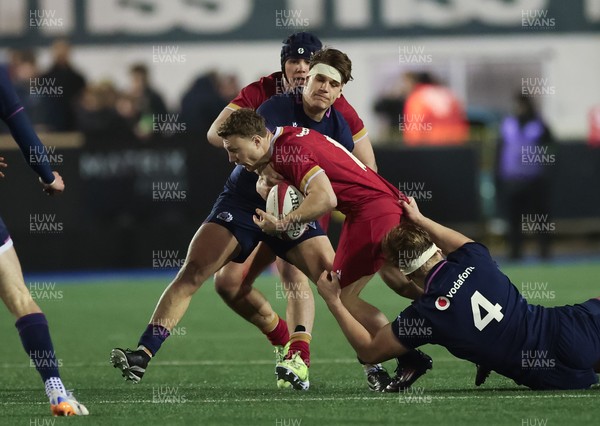 200226 - Wales U20 v Scotland U20, 2026 U20 Six Nations - Tom Bowen of Wales takes on Christian Lindsay of Scotland’