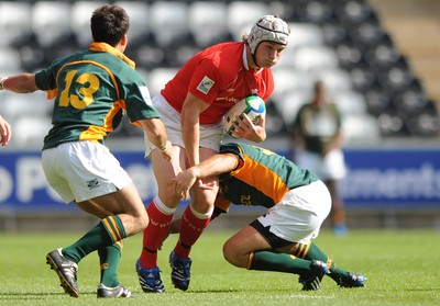 22.06.08 - Wales Under 20 v South Africa Under 20 - IRB Junior World Championship 2008 - 3rd Place Play-Off - Wales' Jonathan Davies is tackled by South Africa's Francois Brummer. 