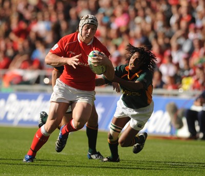 22.06.08 - Junior World Championship 2008 3rd Place Play Off - Wales v South Africa Wales' Jonathan Davies tries gets past South Africa's Cecil Afrika 
